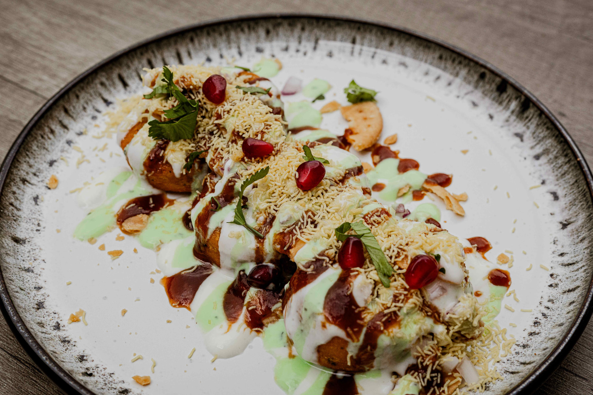 Crisp street-style chaat with yoghurt, chutneys and pomegranate at Bukharaa in Romiley