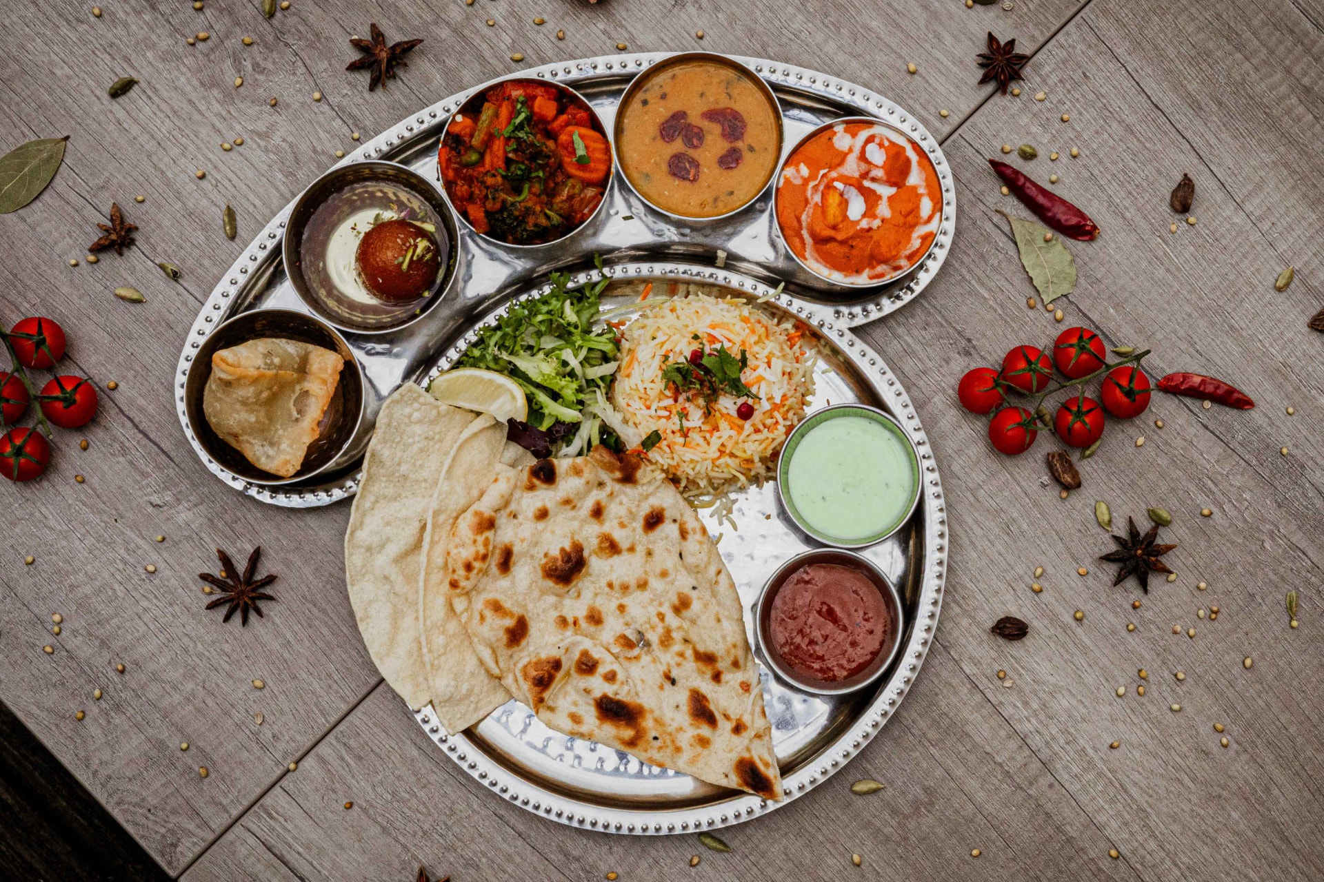 Traditional Indian thali platter with curries, rice, naan and chutneys at Bukharaa in Romiley